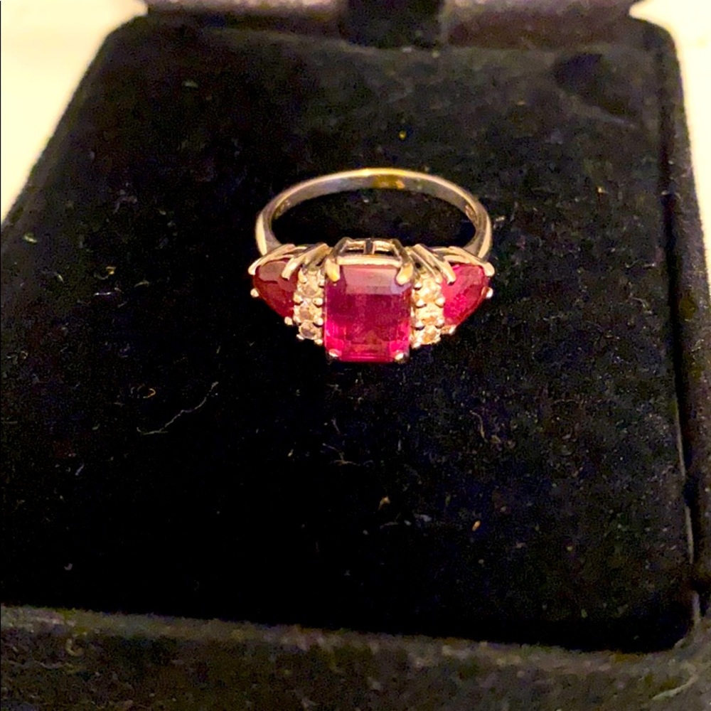 Garnet and diamond ring on white gold band.